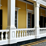 Historical Building Assessment**

"A professional building appraiser, fully clothed in appropriate attire, examining the facade of a well-maintained colonial-era building in Georgetown, Malaysia. The scene is during daylight, showcasing intricate architectural details. Safe for work, appropriate content, perfect anatomy, natural proportions, modest clothing, professional setting."

**